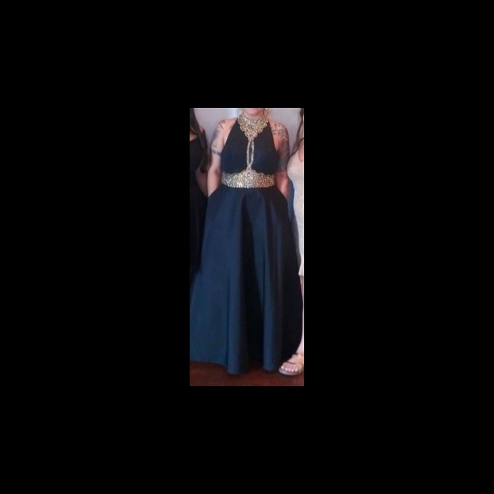 Black dress with gold accents. Morilee design by Madeleine Gardner. size 9/10